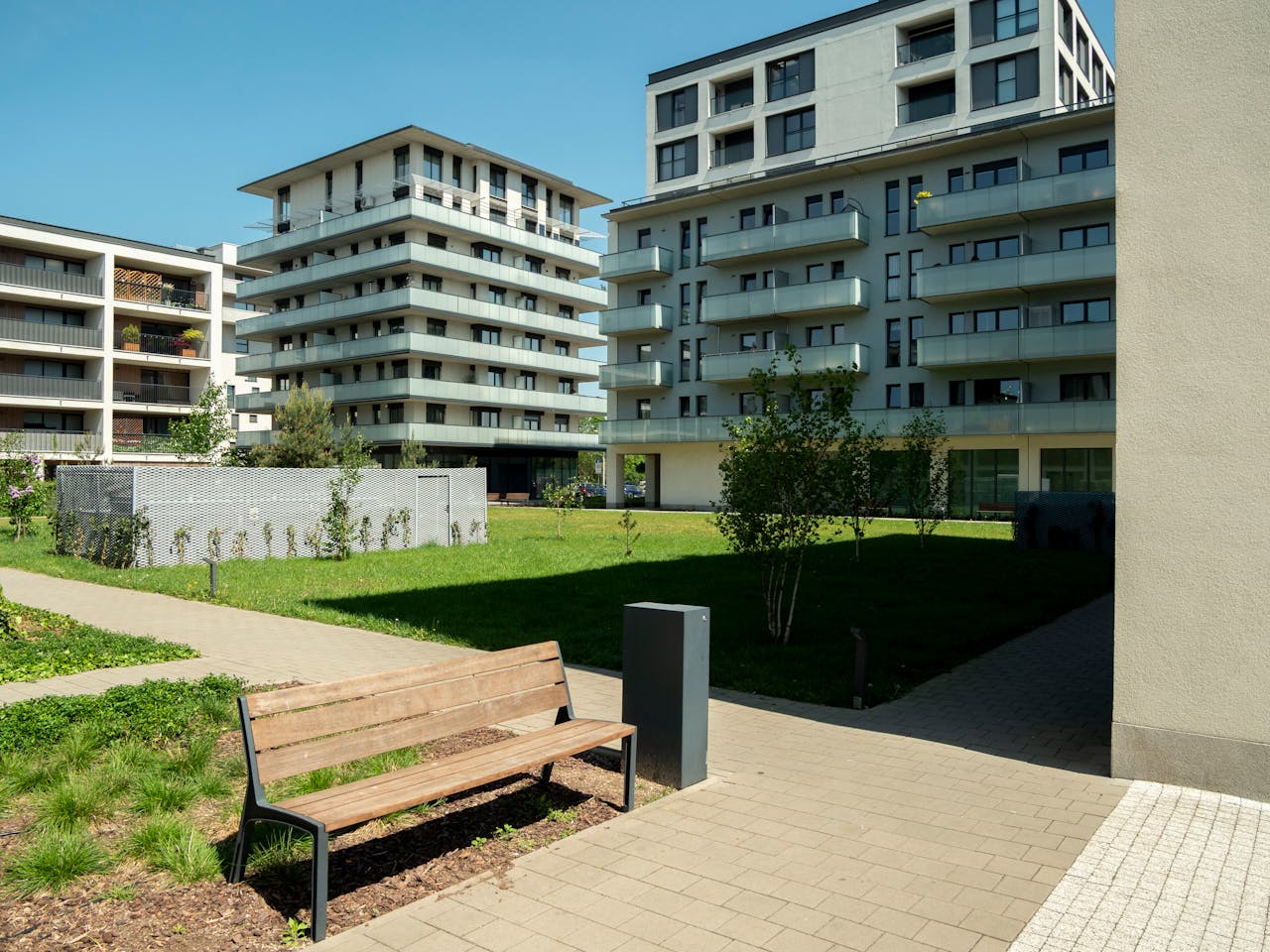 Contemporary apartment buildings with green spaces in Wrocław, Poland.